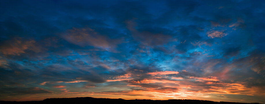 Fototapeta Cloudy sky panorama during sunset
