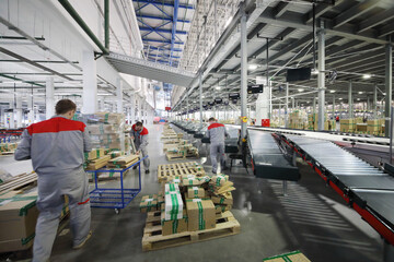 three man - People work in warehouse and sorting center of internet shop,