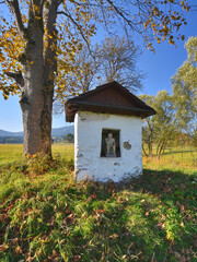 Old small chapel of Pensive Christ  in autumn sunny day, Skwirtne, Low Beskids (Beskid Niski), Poland.
