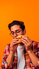 Mexican man eating mexican taco over yellow background with copy space.