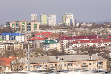 Naklejka premium aerial panoramic view from great height of city with a private sector and high-rise urban apartment skyscraper buildings