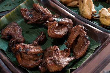 Soy sauce fried chicken served on banana leaves. Javanese cuisine