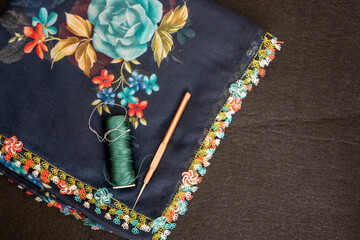 Hand knitted scarf and headscarf samples, handmade embroidered head scarf close-up.