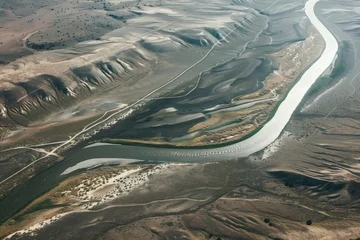 Foto op Plexiglas aerial shot of a river acting as a natural border © stickerside