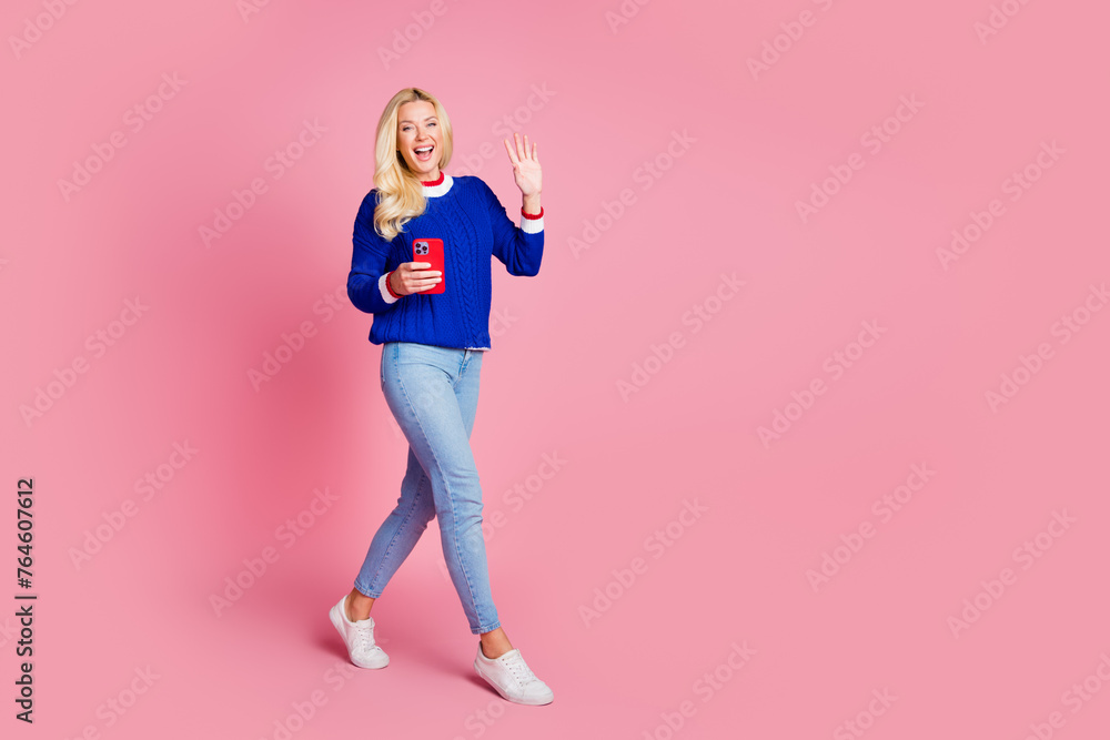 Sticker full body portrait of pretty lady hold smart phone arm wave empty space wear blue sweater isolated o