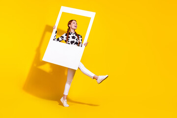 Full length portrait of charming overjoyed person hold set album card dance empty space ad isolated on yellow color background - obrazy, fototapety, plakaty