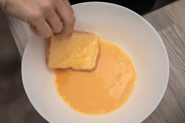 Dipping Bread into Egg Mixture