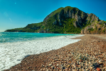 beautiful pebble beach and emerald water. Mediterranean coast.