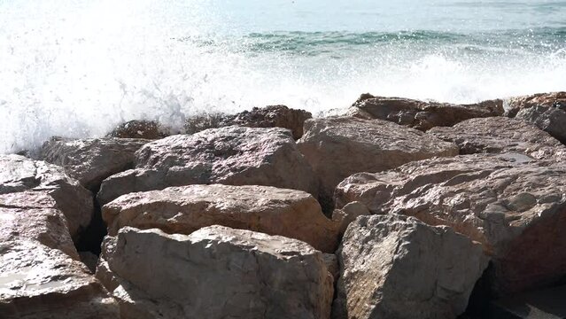 Sea waves crashing against the rocks.