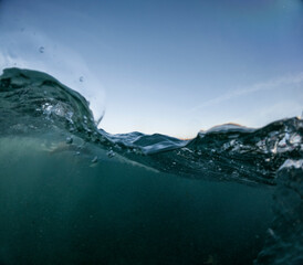 Underwater perspective of the tranquil ocean at dusk