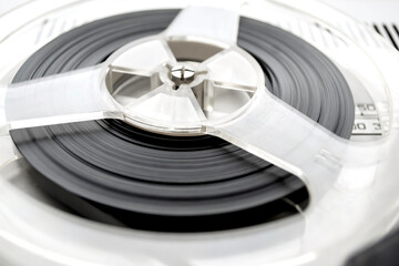 Audio recording on a reel. Film on a reel. Film cassette. Vintage audio reel.