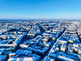 Aerial view of snowy Helsinki with a clear blue sky and the old fire station  in the center