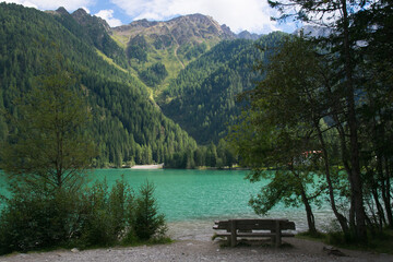 A romantic bench on the famous Anterselva lake in Alto Adige, Italy - 764637624