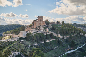 Fototapeta na wymiar The medieval town of Alarcón, sandwiched between the steep gorges of the Júcar River in the province of Cuenca. With its walls and castle converted into a National Parador. Castile and La Mancha. Spai