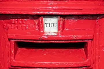 Fototapeten Thursday word shown as THU on a British red letter box. Visually striking and colorful landscape format image depicting the day of the week. Bright red. Letter box and postal image.  © Steven