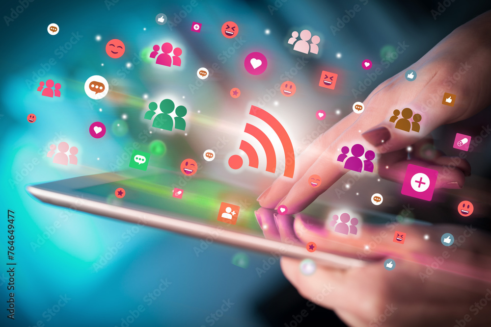 Aufkleber close-up of a hand using tablet with social media icons