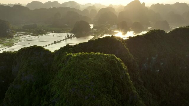 beautiful Vietnam nature, Tam Coc valley in Vietnam, Ninh Binh aerial view at sunrise, tropical vacation in Vietnam, travel in Asia