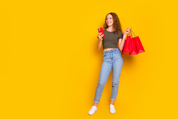 Photo of adorable lovely girl wear trendy outfit look offer low price clothes purchase special news isolated on yellow color background