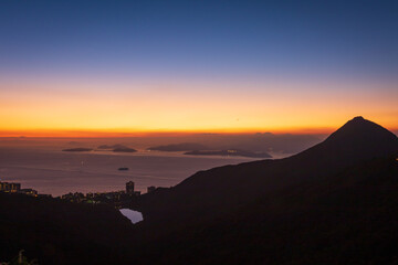 Naklejka na ściany i meble Golden Horizon: A Glimpse of Sunset from Victoria Peak, Hong Kong