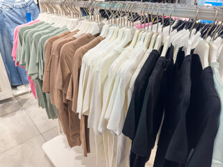 New collection women's clothing on hangers in a boutique