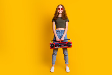 Photo of positive girl dressed stylish clolthes hold boombox have fun vacation chill weekend...