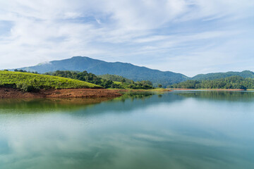 Fototapeta na wymiar Beautiful scenery of Wayanad with mountains and greenery beside Banasura Saggar Dam.