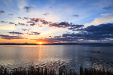 Dawn’s First Light: Serene Sunrise at Lake Biwako, Japan