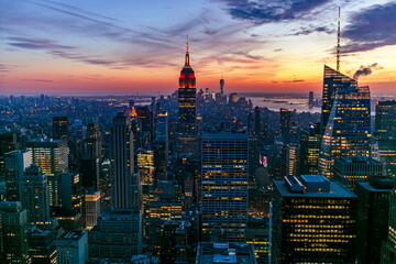 New York Manhattan view from One World Trade Center. sunset view with financial buildings city light. Empire State building on sunset 