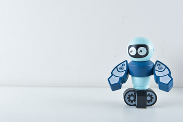 Portraits of blue color robot standing on white background flat lay, lot of space to add custom product or content to symboling automation and future. Useful image for AI company, automation tools