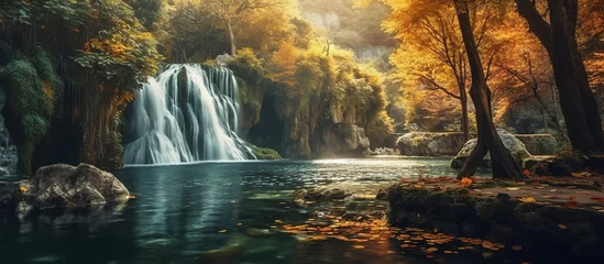  Colorful majestic waterfall in national park forest © ismodin