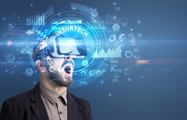 Businessman looking through VR glasses