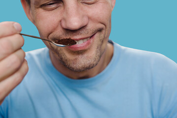 Portrait of smiling healthy recovered man smelling scent of fresh coffee. Recovery journey:...