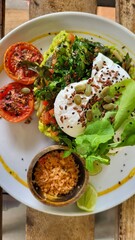 breakfast with vegetables and a poached egg.