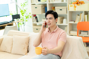 Photo of young Asian man at home
