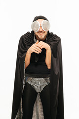 Man Dressed in Insect Costume Posing With Fly-Esque Goggles and Cape