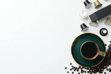 Foto op Aluminium Coffee capsules and beans, cup with coffee drink on white background, space for text © Atlas