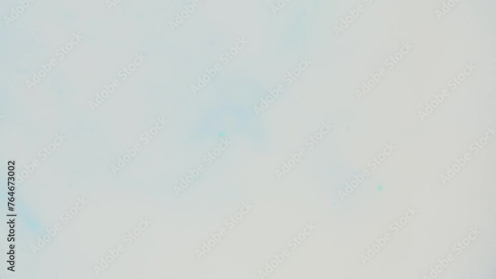 Poster soft turquoise ink cloud diffusing in water creating an ethereal abstract effect, ideal for backgrou
