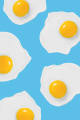 Eggs on a blue background pattern. Flat lay, top view,