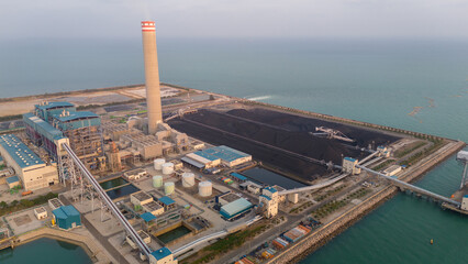 Heavy industrial coal power electricity plant with chimney and pipes, lignite coal product mass ready to be energy for electricity power plant