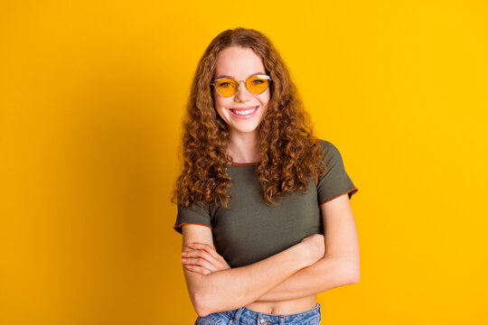 Photo of adorable gorgeous girl dressed nice outfit standing crossed arms isolated on yellow color background