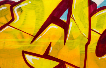 Colorful background of graffiti painting artwork with bright aerosol outlines on wall. Old school...