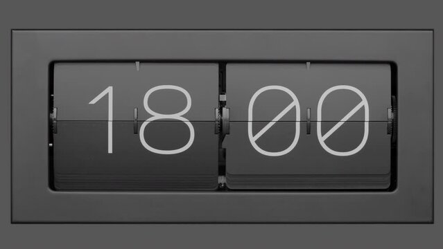 Flip clock quickly flips. .Retro flip clock changing from 17:59 to 18:00. Slow motion. Close up.