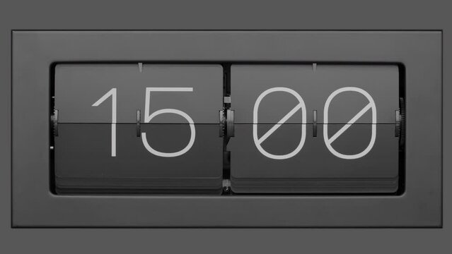 Flip clock quickly flips. .Retro flip clock changing from 14:59 to 15:00. Slow motion. Close up.