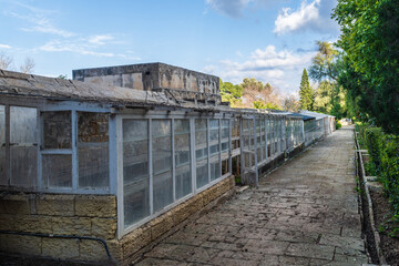 Fototapeta na wymiar San Anton Gardens, Attard, Malta - March 11th 2022: Greenhouses in the grounds of San Anton Palace, the summer residence for the Grand Masters of Malta and has been a public garden since 1882.