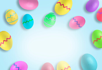 Colorful Easter eggs on pastel blue background. Copy space
