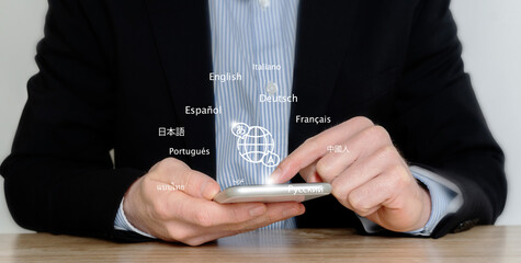 Person uses a mobile smartphone with a translation application to translate foreign languages....