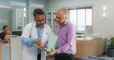 Indian Healthcare Service: Professional Medical Doctor Talking to His Patient, Sharing Good News...