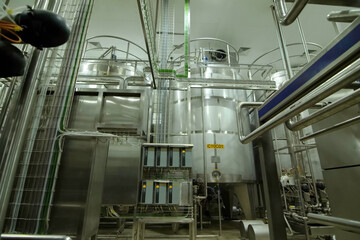 Equipment of winery. Large and small tanks for technological processes.