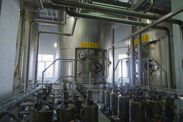 Equipment of winery. Large and small tanks for technological processes.