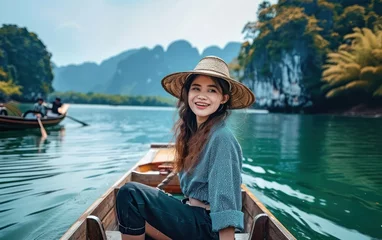 Foto op Canvas happy young woman tourist on the boat at lake © Muh